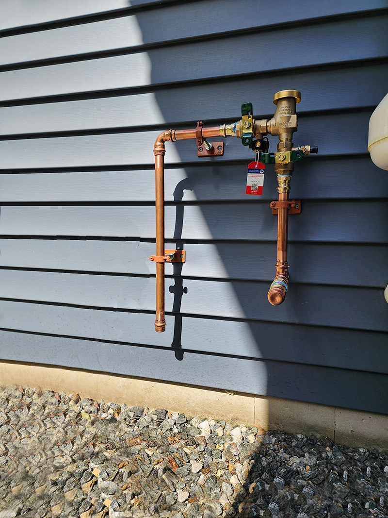Sprinkler Plumbing on outer wall by NRP Plumbing & Heating